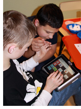 Boys using AAC Device